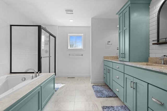 11464 Wagon Wheel Curv, Woodbury, MN 55129 - full bath with a stall shower, vanity, a garden tub, and baseboards