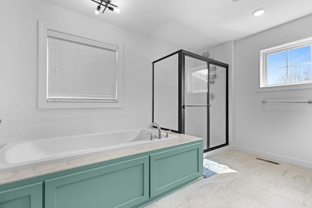 11464 Wagon Wheel Curv, Woodbury, MN 55129 - bathroom with a garden tub and a stall shower