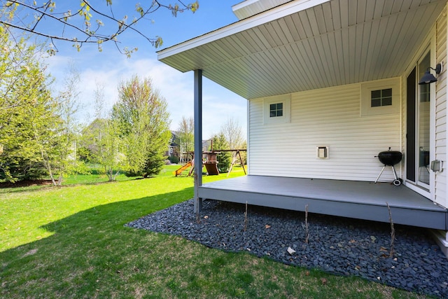 11464 Wagon Wheel Curv, Woodbury, MN 55129 - view of green lawn featuring a wooden deck and a playground