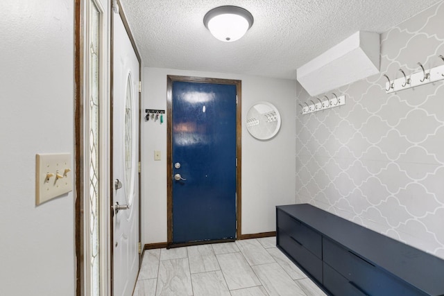 7900 Idaho Cir N, Brooklyn Park, MN 55445 - mudroom featuring a textured ceiling