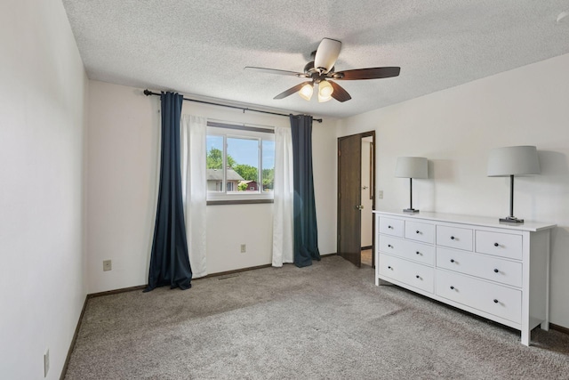 7900 Idaho Cir N, Brooklyn Park, MN 55445 - bedroom featuring light carpet, a textured ceiling, a ceiling fan, and baseboards