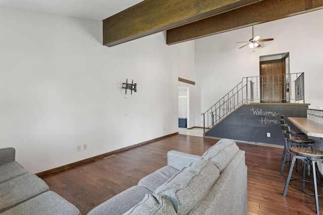7900 Idaho Cir N, Brooklyn Park, MN 55445 - living room featuring stairway, a ceiling fan, high vaulted ceiling, baseboards, and wood finished floors