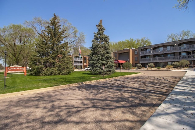 view of home's community with a lawn