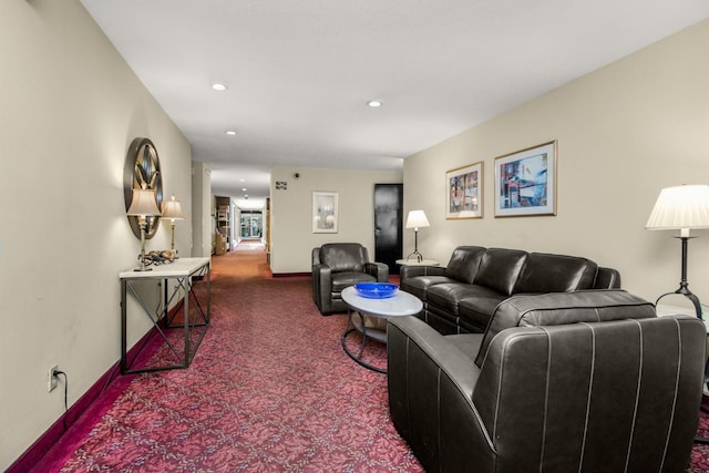 carpeted living area with baseboards and recessed lighting