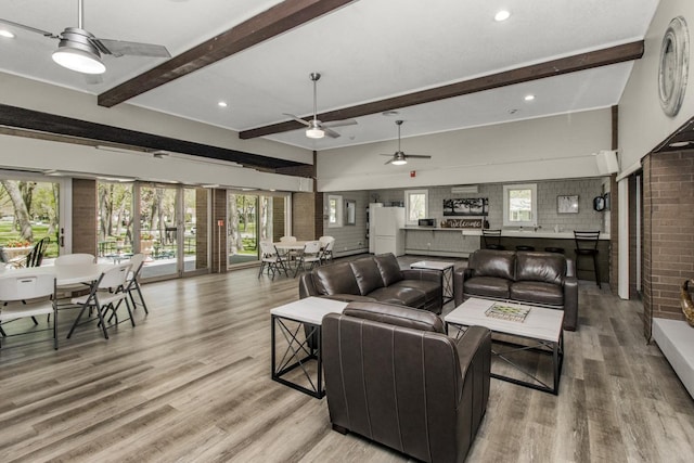 living room with ceiling fan, light wood-type flooring, beam ceiling, and recessed lighting