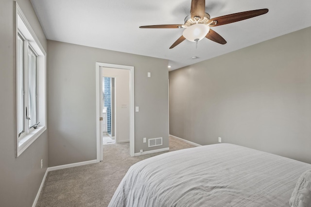 25985 Smithtown Rd, Shorewood, MN 55331 - bedroom with light carpet, baseboards, and multiple windows