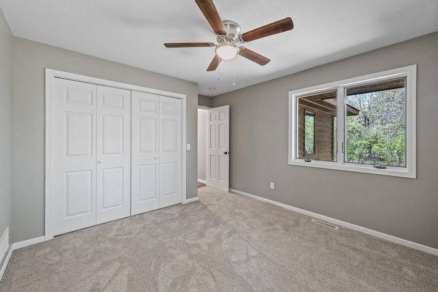 25985 Smithtown Rd, Shorewood, MN 55331 - unfurnished bedroom featuring carpet flooring, baseboards, and a closet