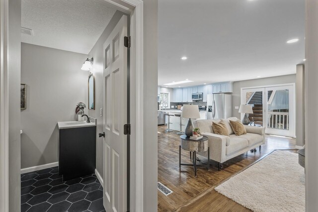 25985 Smithtown Rd, Shorewood, MN 55331 - living room with recessed lighting, baseboards, and dark wood-type flooring