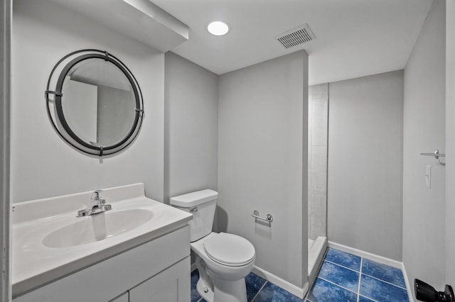 25985 Smithtown Rd, Shorewood, MN 55331 - full bathroom featuring toilet, vanity, a stall shower, baseboards, and tile patterned floors