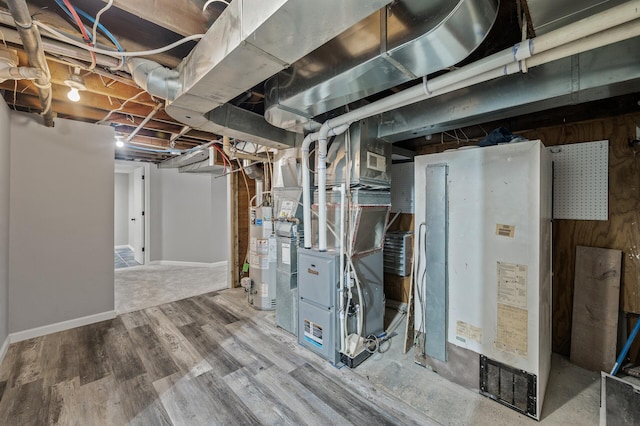 25985 Smithtown Rd, Shorewood, MN 55331 - unfinished below grade area featuring gas water heater, wood finished floors, and heating unit