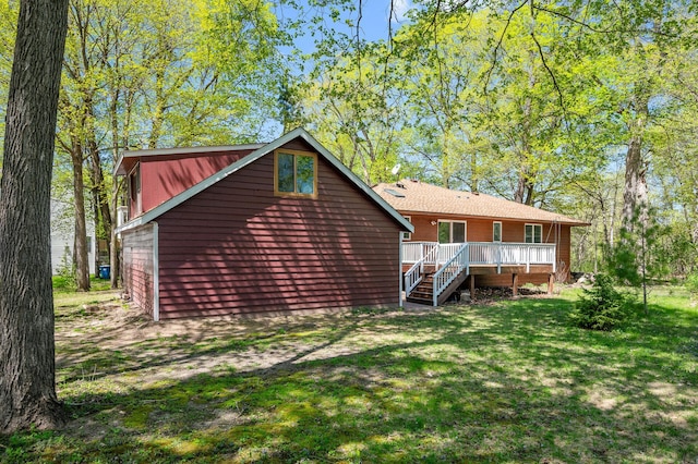 25985 Smithtown Rd, Shorewood, MN 55331 - rear view of house featuring a wooden deck, a lawn, and stairway