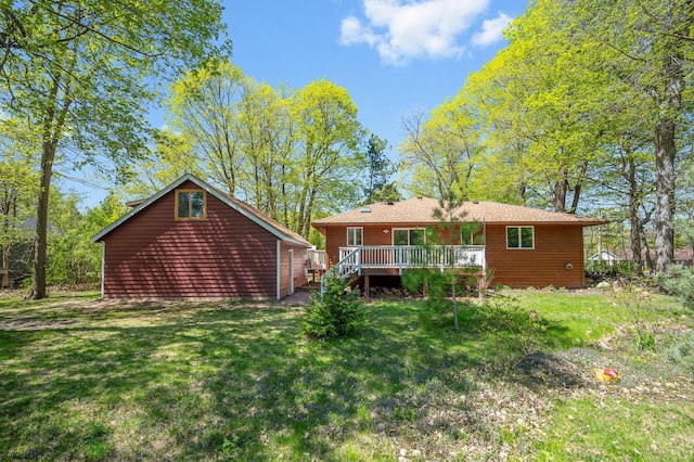 25985 Smithtown Rd, Shorewood, MN 55331 - rear view of house featuring a wooden deck and a lawn