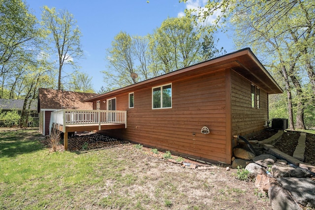 25985 Smithtown Rd, Shorewood, MN 55331 - rear view of house featuring a deck and central AC unit