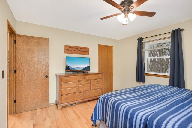 bedroom featuring a ceiling fan and wood finished floors