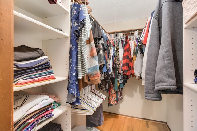 spacious closet with wood finished floors