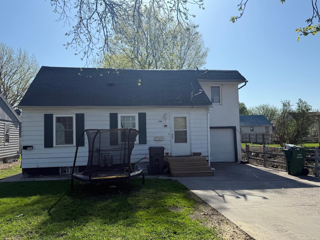 view of front of home featuring a garage and concrete driveway