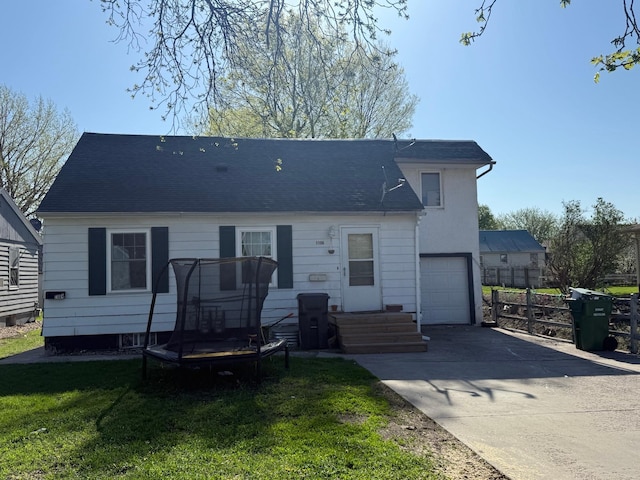 view of front of home featuring a garage and concrete driveway