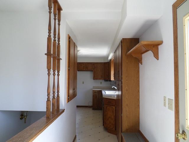 202 Buse Ave NE, Red Lake Falls, MN 56750 - hallway featuring light floors and a sink