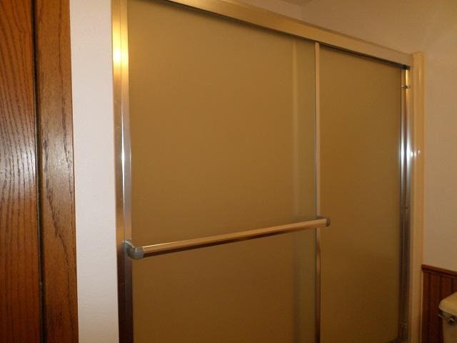 202 Buse Ave NE, Red Lake Falls, MN 56750 - room details with an enclosed shower and toilet