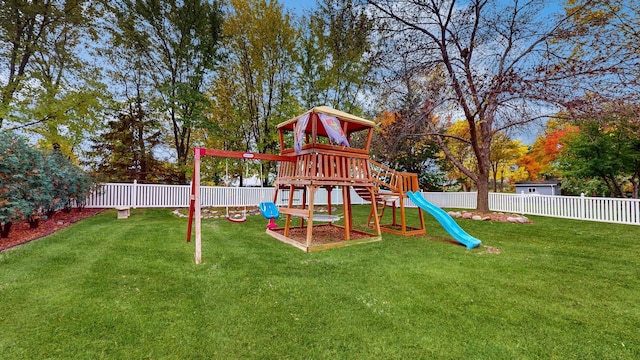 view of jungle gym with a yard and a fenced backyard