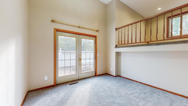 doorway to outside with baseboards, french doors, visible vents, and carpet