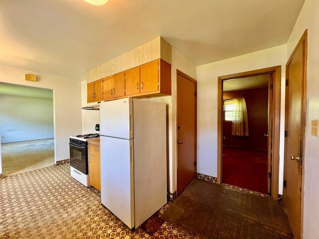 kitchen with white appliances and brown cabinets