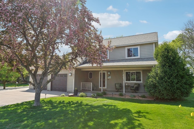 view of front of house featuring concrete driveway, a porch, a front lawn, an attached garage, and a shingled roof