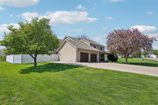 view of front of house with an attached garage, driveway, and a shingled roof