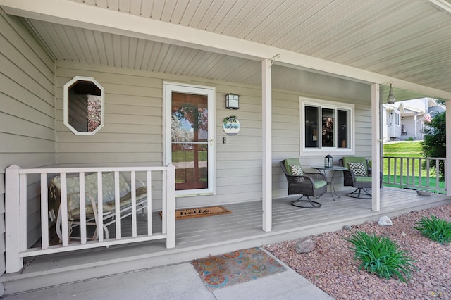 entrance to property featuring covered porch