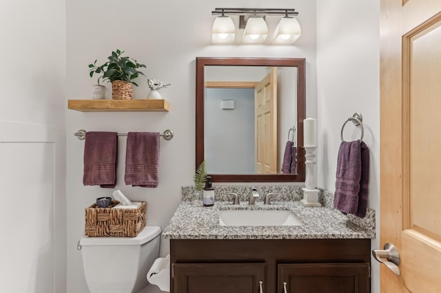 half bath with toilet and vanity