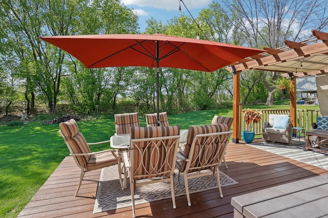 wooden deck featuring a pergola, a yard, outdoor dining area, and view of wooded area