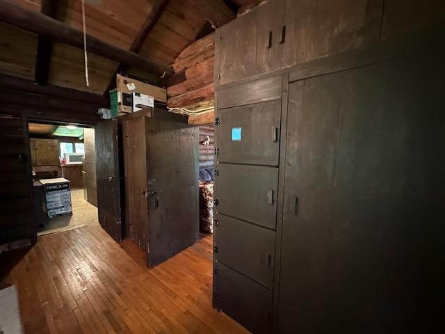 kitchen with wooden ceiling, wood-type flooring, and lofted ceiling with beams
