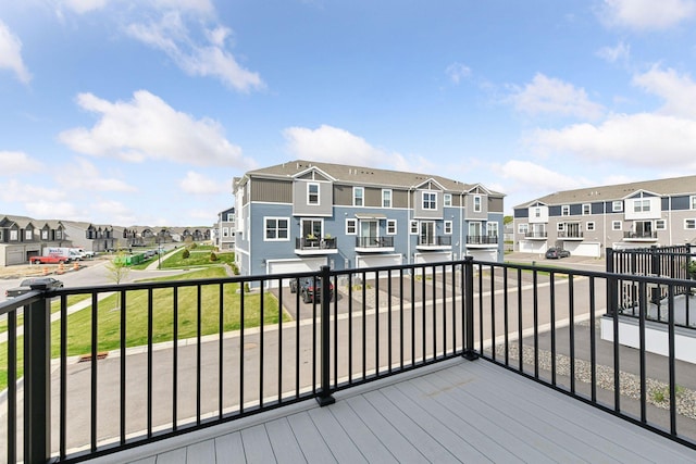 wooden deck featuring a residential view