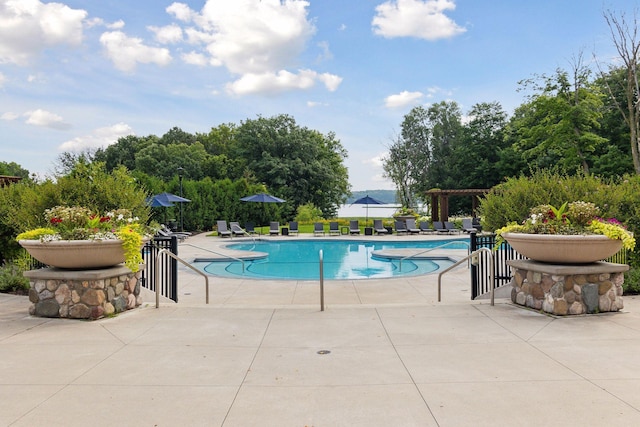 community pool featuring a patio area