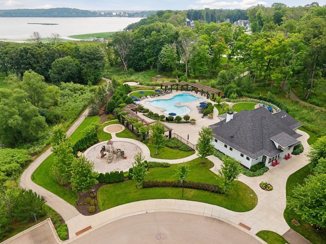 bird's eye view of a large body of water and a pool area