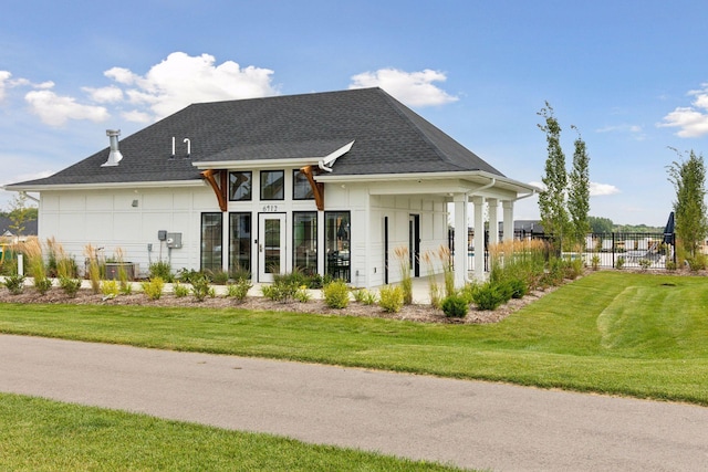 back of house featuring central AC unit