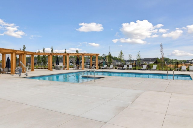 community pool with fence, a pergola, and a patio area