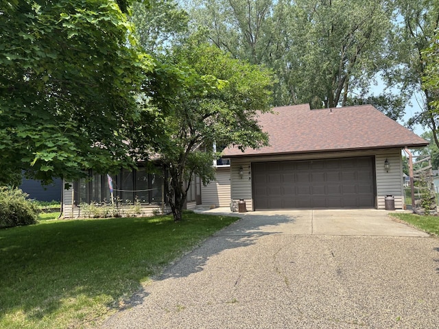 783 Berwood Ave, Vadnais Heights, MN 55127 - view of property hidden behind natural elements featuring concrete driveway, a garage, and a front lawn
