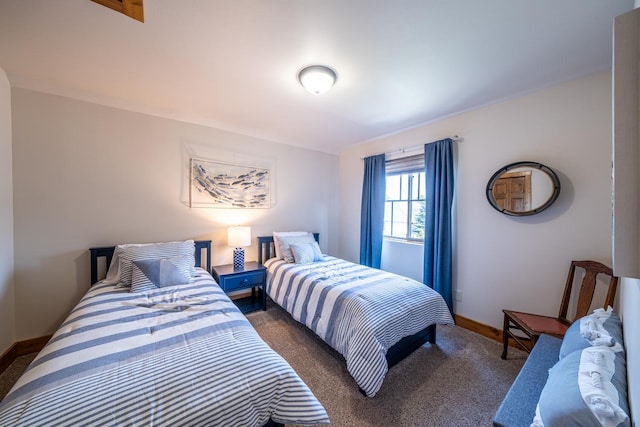 carpeted bedroom featuring baseboards