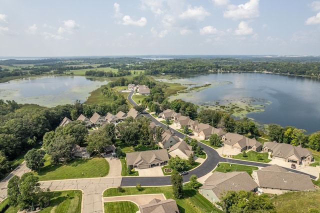 bird's eye view with a water view and a residential view