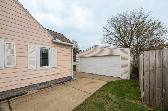 detached garage with fence