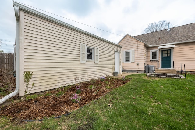 back of property featuring central air condition unit