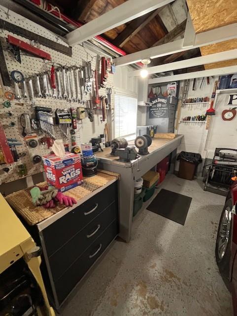 basement with a workshop area