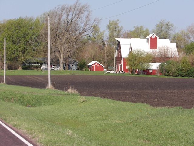 view of street with a barn