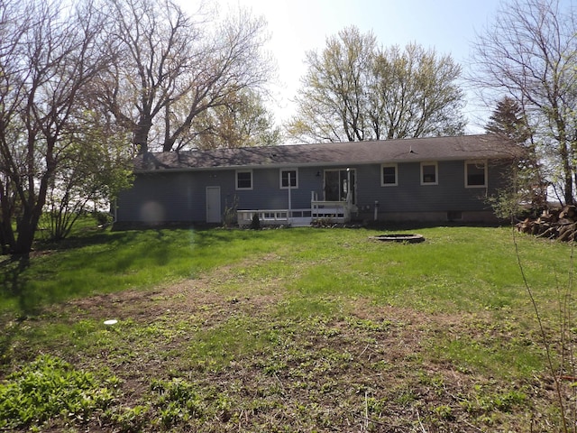 rear view of house with a yard