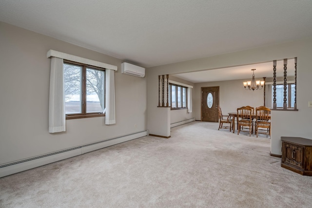 37229 790th Ave, Rosendale Twp, MN 56060 - carpeted living area with a baseboard radiator, an AC wall unit, baseboards, and an inviting chandelier