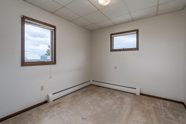 37229 790th Ave, Rosendale Twp, MN 56060 - empty room with a paneled ceiling, carpet flooring, and baseboards