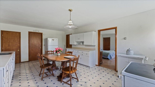 dining space featuring light floors