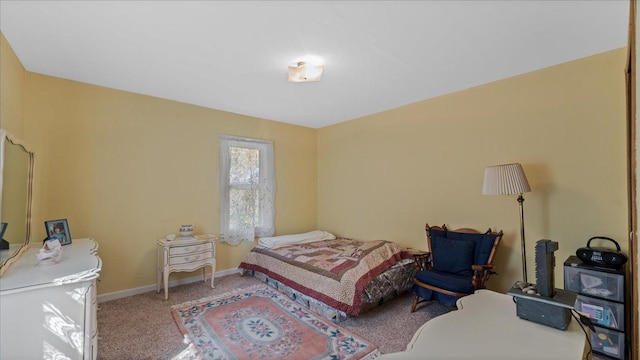 carpeted bedroom with baseboards