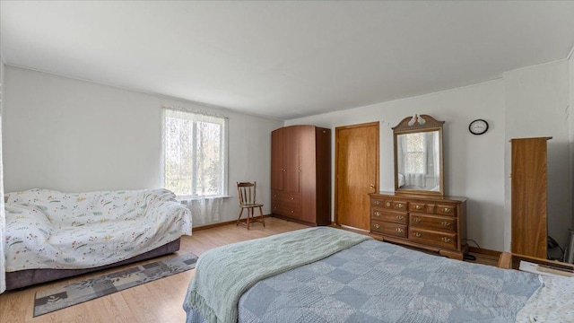 bedroom with wood finished floors